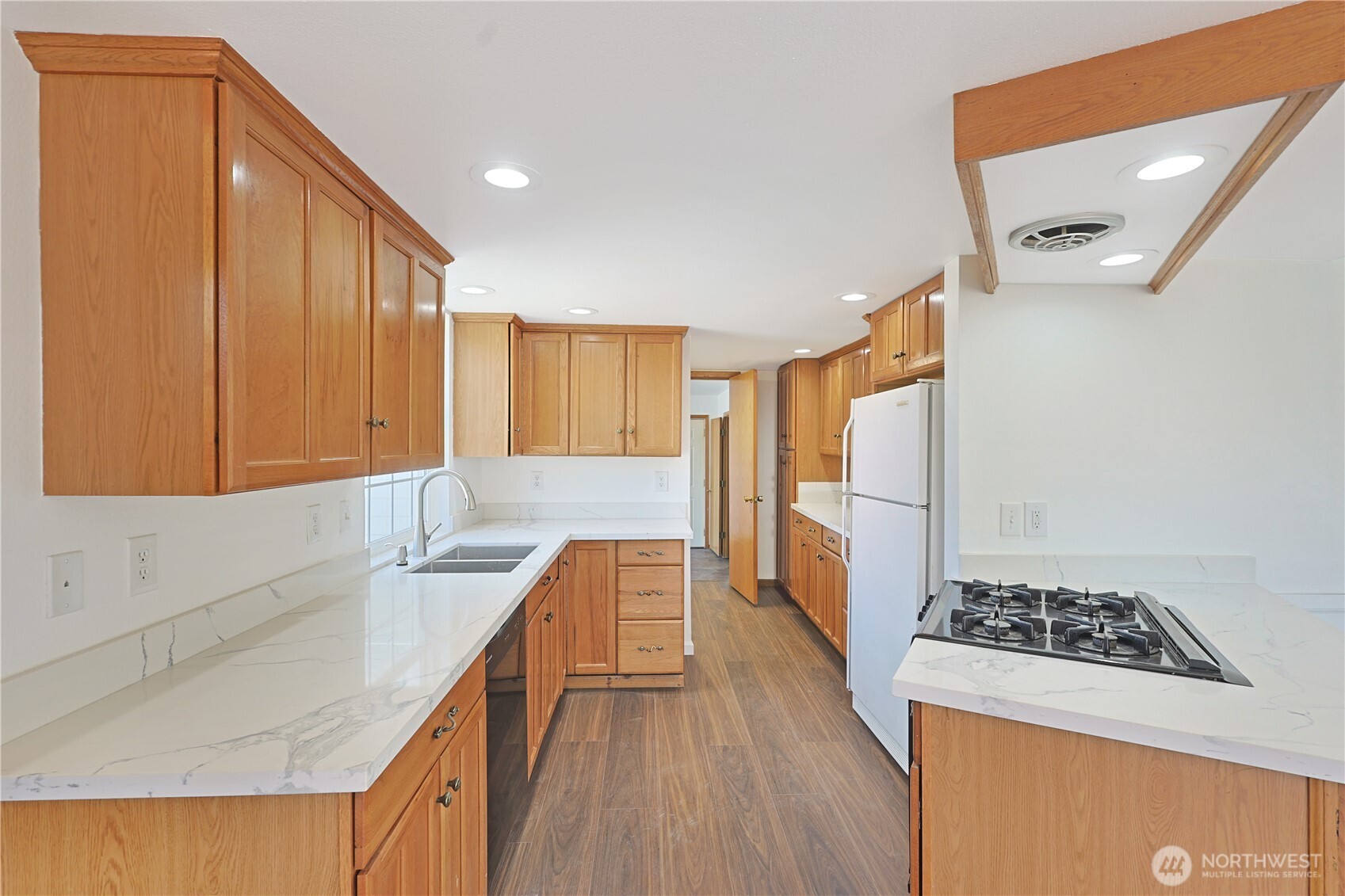 3618 Chrisella Road East Edgewood, WA 98371 - Photo 11 of 33 a kitchen with stainless steel appliances granite countertop a sink stove and refrigerator