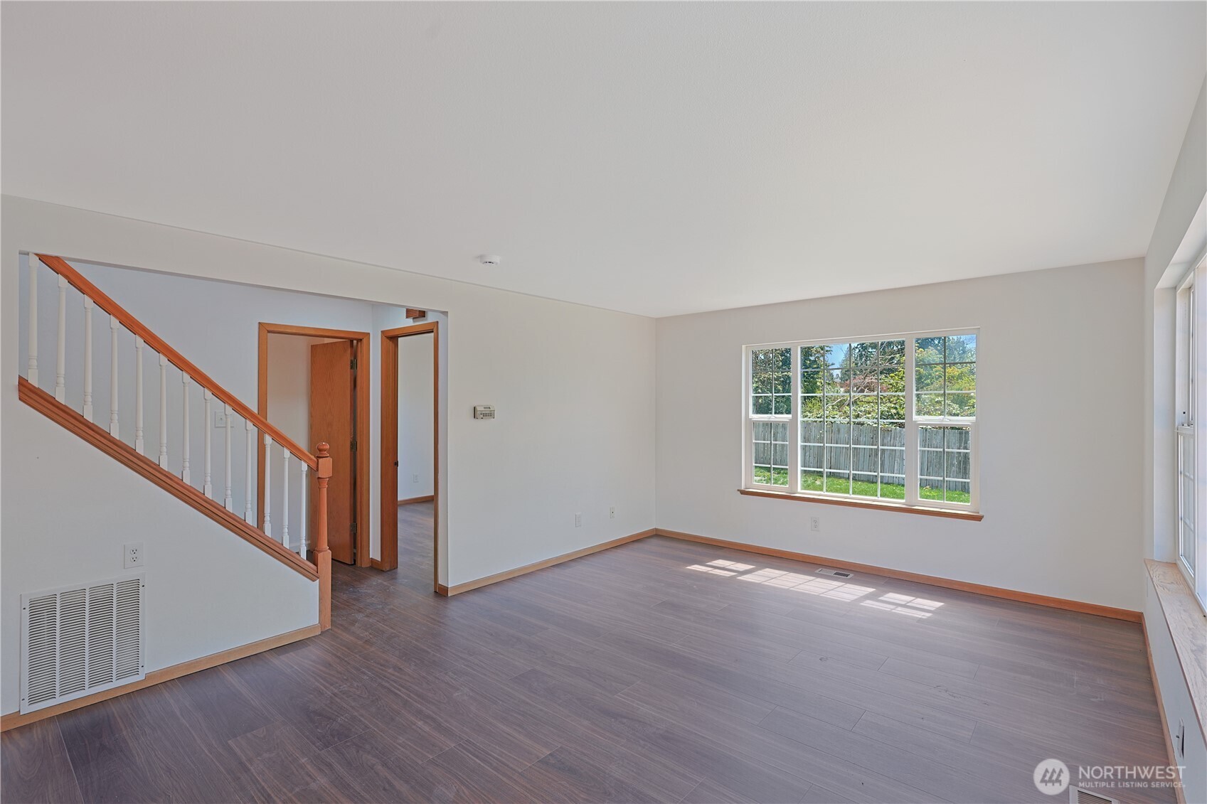 3618 Chrisella Road East Edgewood, WA 98371 - Photo 18 of 33 a view of an empty room with wooden floor and a window