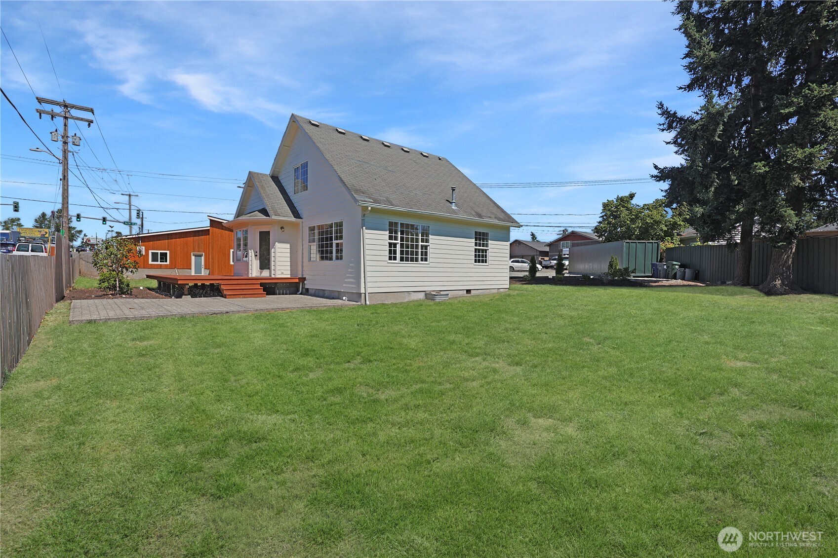 3618 Chrisella Road East Edgewood, WA 98371 - Photo 2 of 33 a view of a house with a big yard and large trees