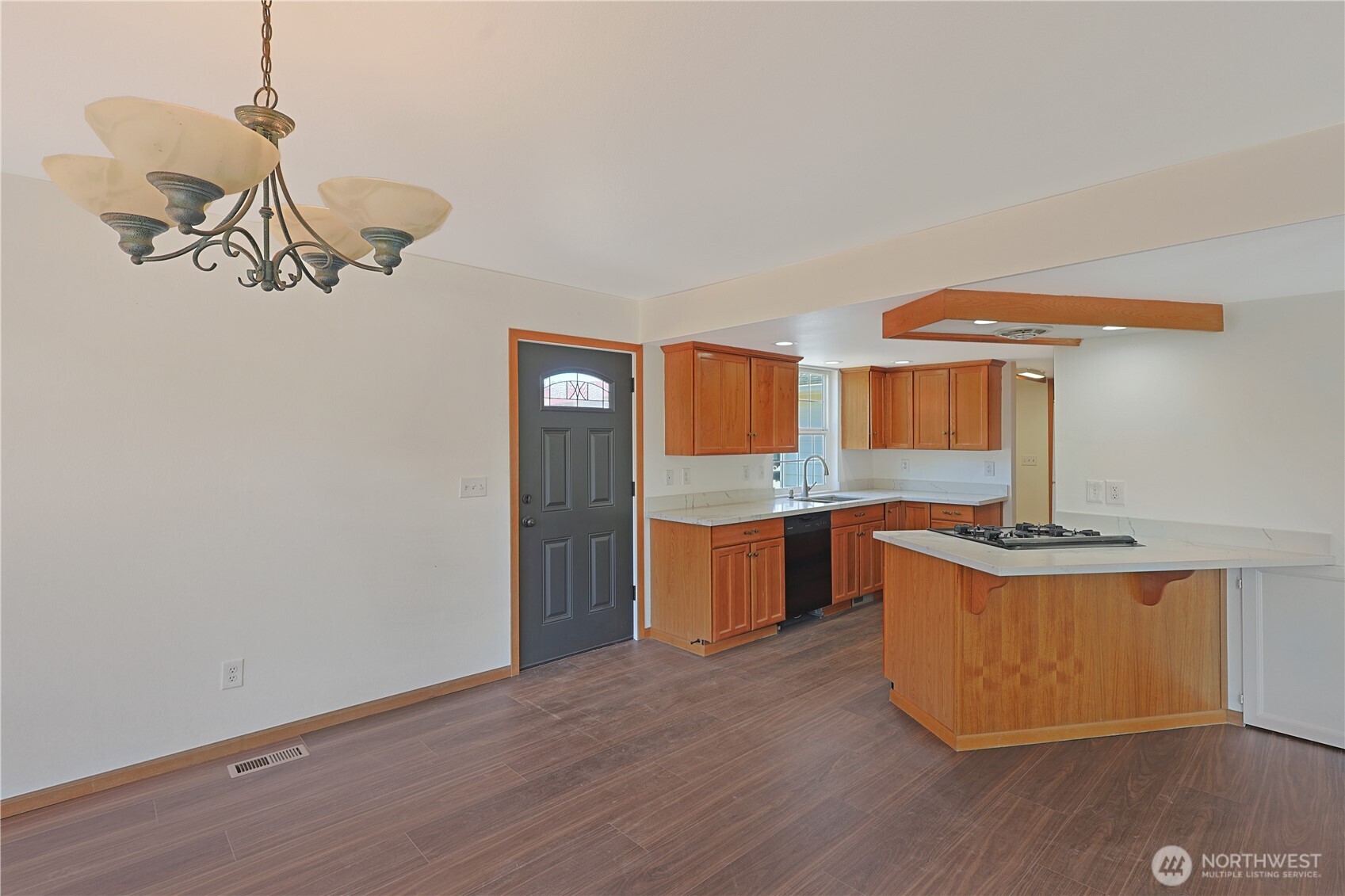 3618 Chrisella Road East Edgewood, WA 98371 - Photo 8 of 33 a kitchen with stainless steel appliances granite countertop a sink a stove a refrigerator cabinets and wooden floor