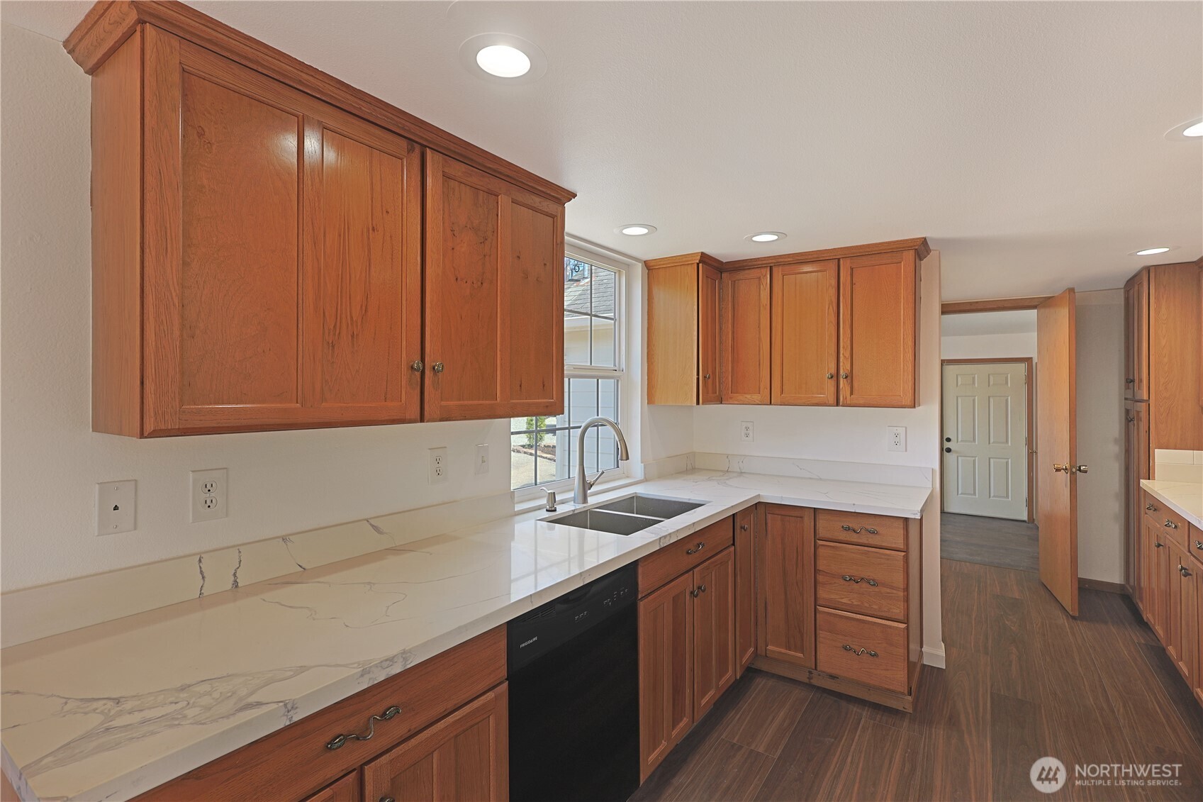 3618 Chrisella Road East Edgewood, WA 98371 - Photo 10 of 33 a kitchen with a sink cabinets and wooden floor