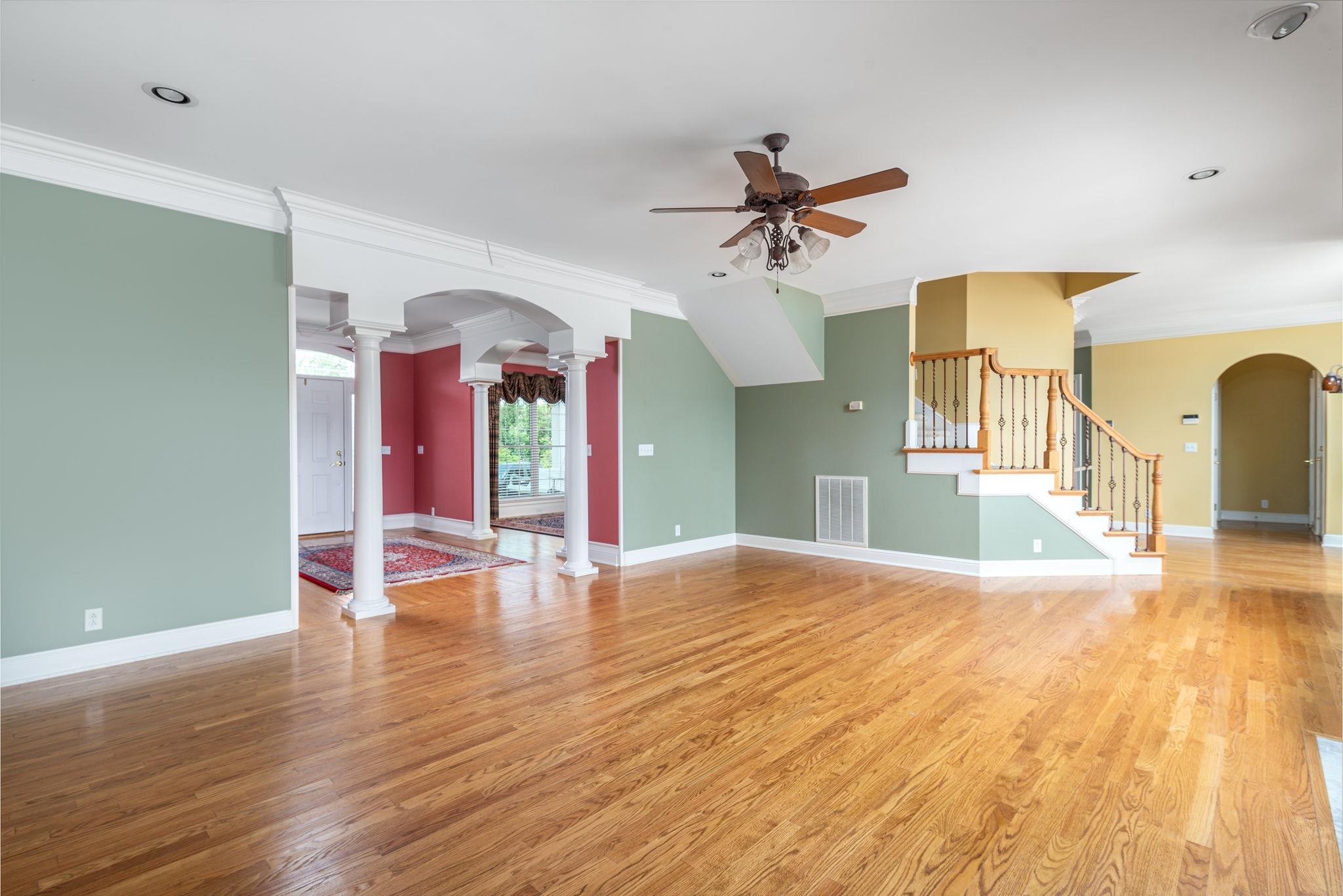6464 Lebanon Road Murfreesboro, TN 37129 - Photo 12 of 30 a view of a livingroom with wooden floor and a ceiling fan