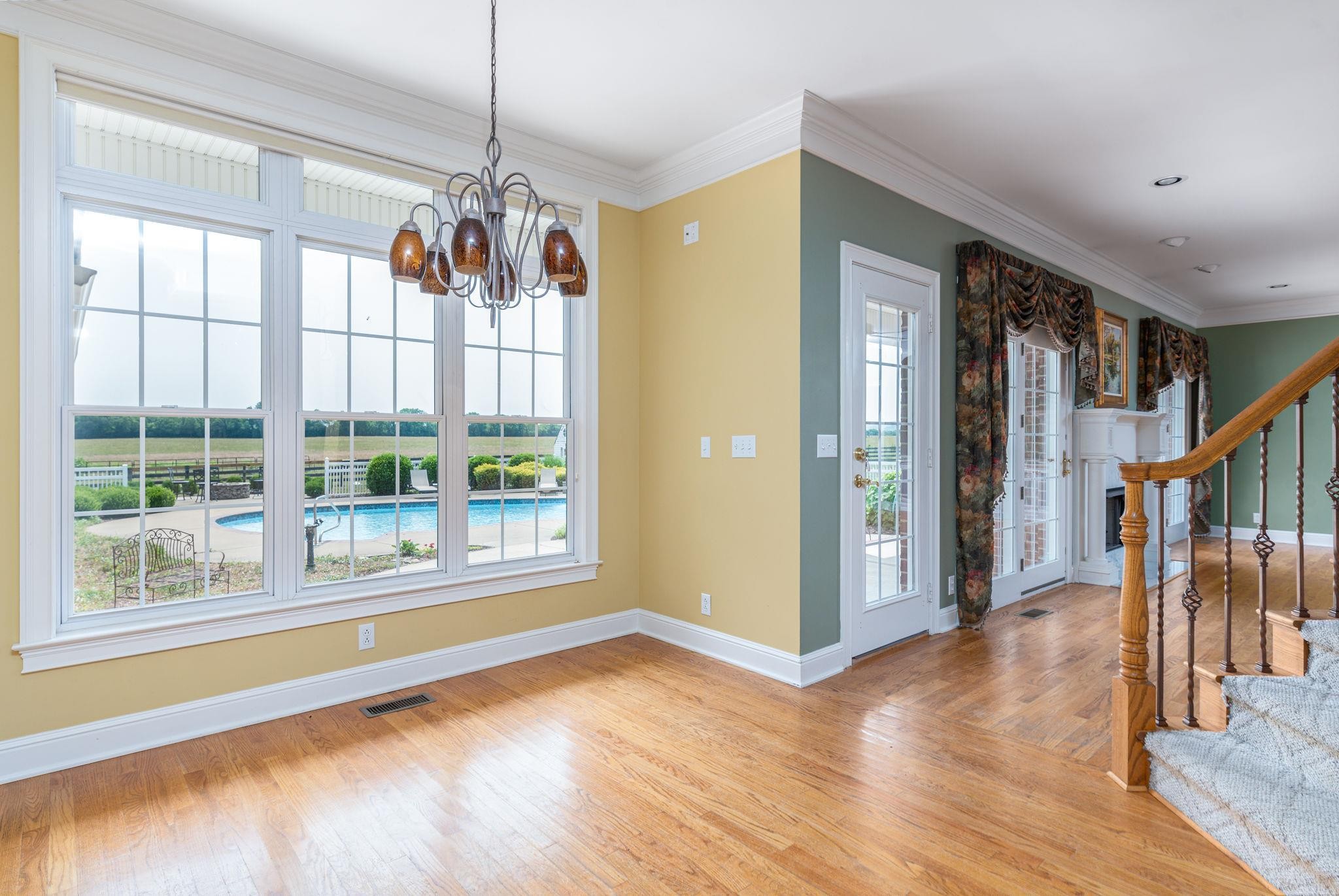 6464 Lebanon Road Murfreesboro, TN 37129 - Photo 13 of 30 a view of a room with wooden floor fireplace and windows