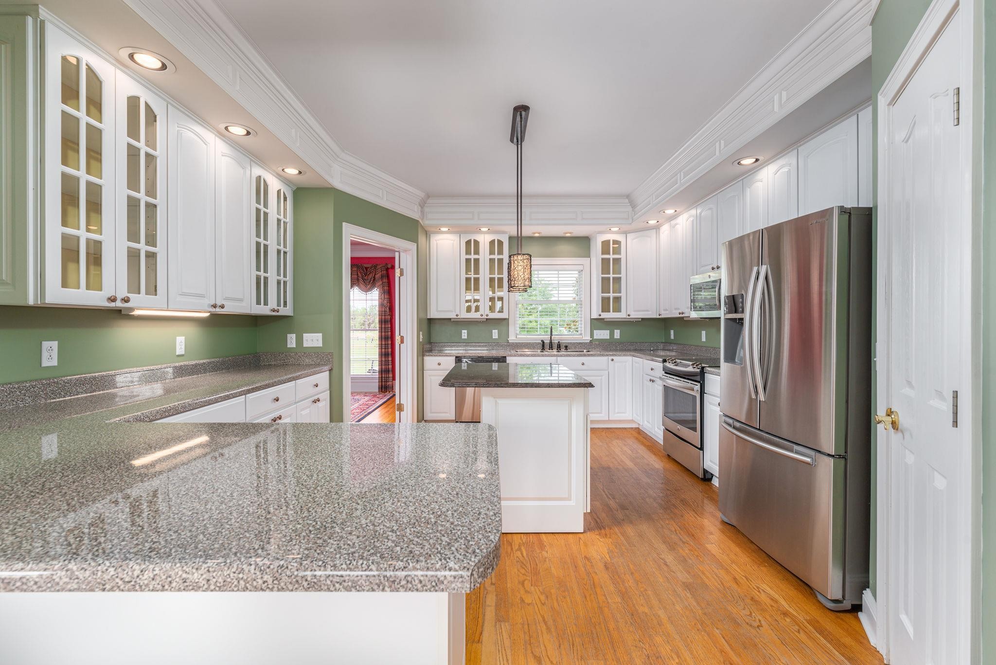 6464 Lebanon Road Murfreesboro, TN 37129 - Photo 15 of 30 a kitchen with stainless steel appliances granite countertop a refrigerator a stove and a sink