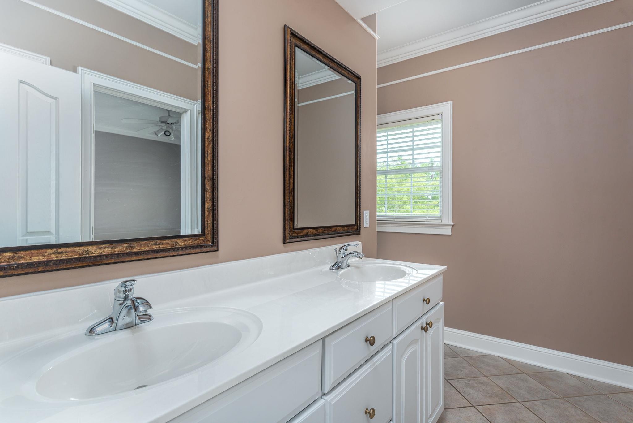 6464 Lebanon Road Murfreesboro, TN 37129 - Photo 22 of 30 a bathroom with a sink and a mirror