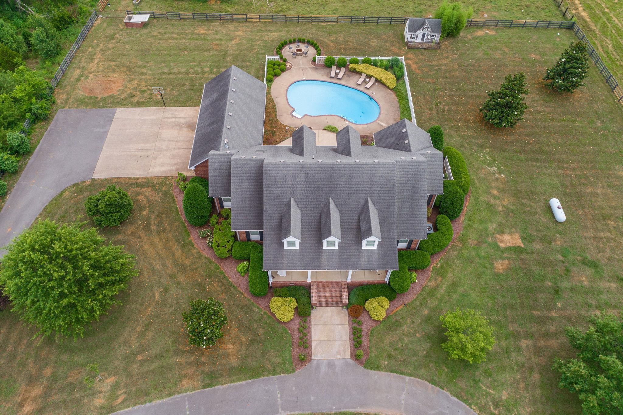6464 Lebanon Road Murfreesboro, TN 37129 - Photo 4 of 30 an aerial view of a house with a garden and lake view