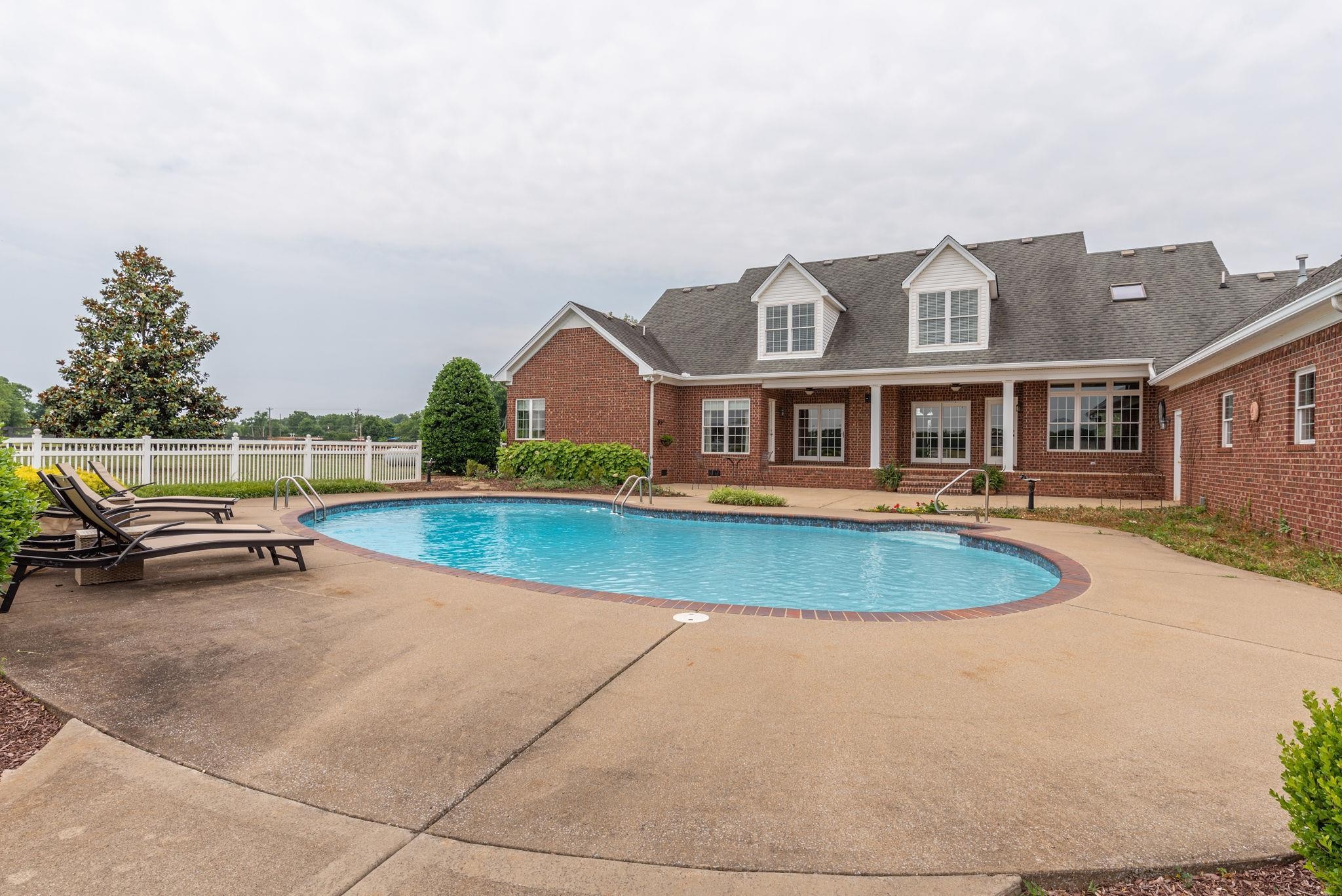 6464 Lebanon Road Murfreesboro, TN 37129 - Photo 7 of 30 an aerial view of a house with swimming pool and patio
