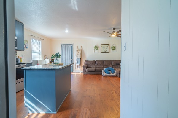 1689 Pleasant Ridge Road Huntland, TN 37345 - Photo 11 of 44 a kitchen with stainless steel appliances a sink and a wooden floor