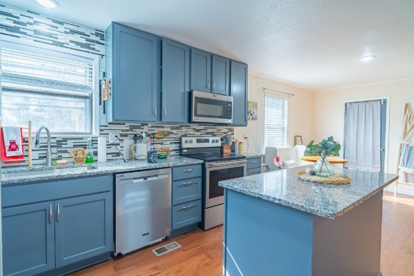 1689 Pleasant Ridge Road Huntland, TN 37345 - Photo 14 of 44 a kitchen with sink cabinets and microwave