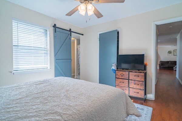 1689 Pleasant Ridge Road Huntland, TN 37345 - Photo 21 of 44 a bedroom with a bed and a flat screen tv