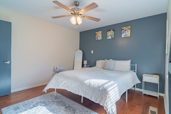 1689 Pleasant Ridge Road Huntland, TN 37345 - Photo 22 of 44 a bedroom with a bed and a chandelier