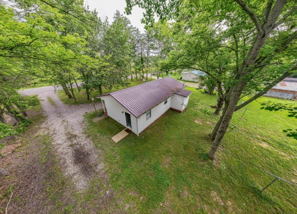 1689 Pleasant Ridge Road Huntland, TN 37345 - Photo 5 of 44 a backyard of a house with table and chairs