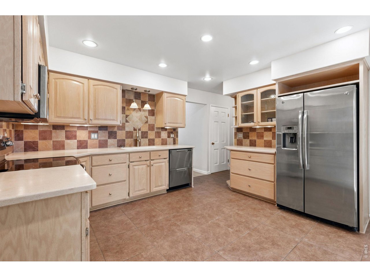2121 18th Street Road Greeley, CO 80631 - Photo 10 of 40 The kitchen features a two draw dishwasher system that easily and efficiently wash small loads. Don't miss all the pull out drawer for storage