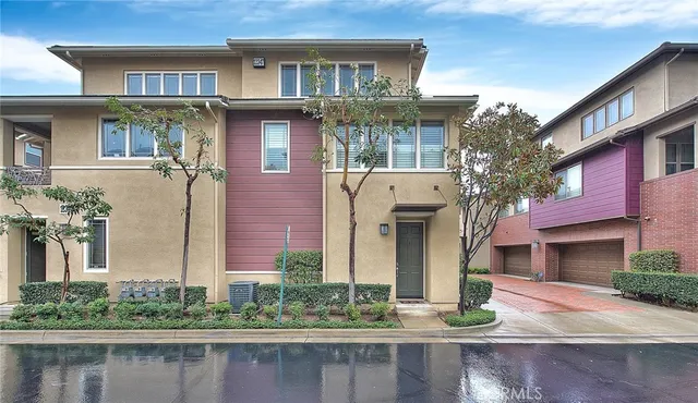 a front view of a house with lake view and windows