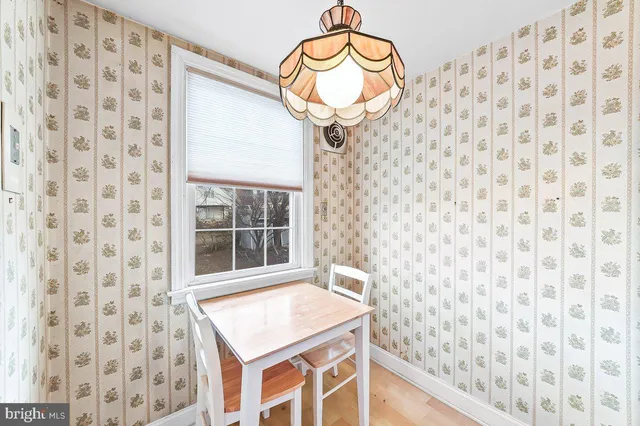 a bathroom with a sink a vanity and a shower curtain
