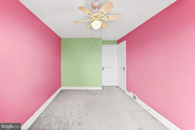 a view of a big room with carpet