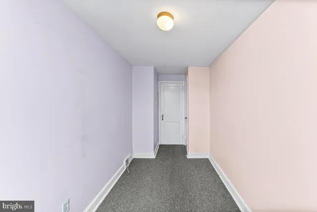 a bathroom with a granite countertop sink toilet a mirror a bathtub and shower