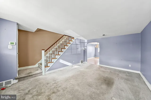 a view of a hallway with staircase