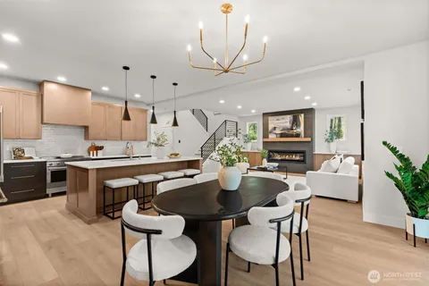 a view of kitchen with sink dining table and chairs