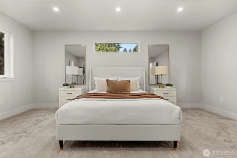 a bedroom with a bed and window