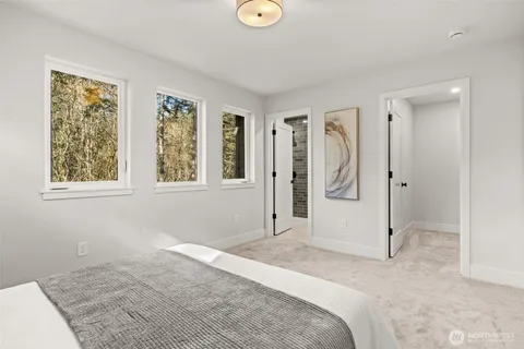 a view of a livingroom with wooden floor and window