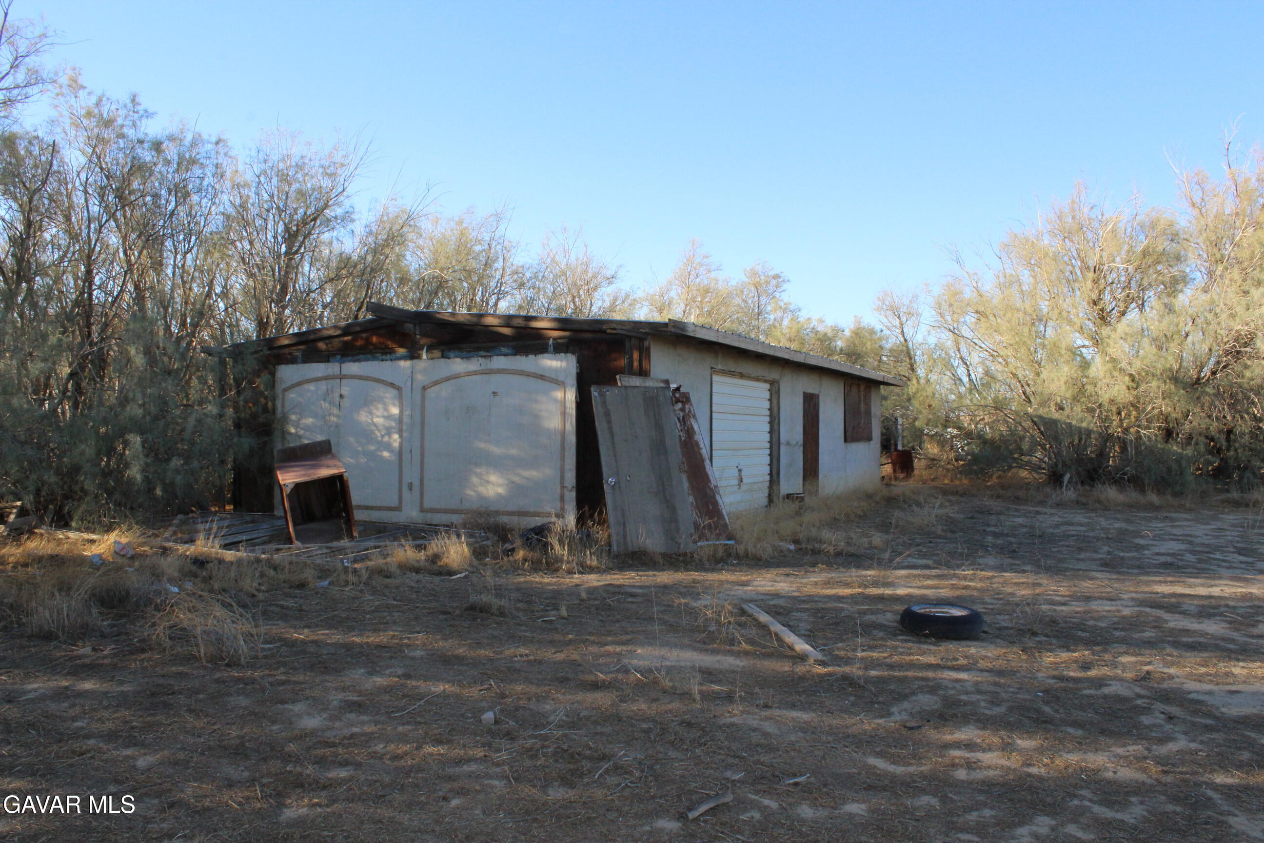 9485 Elberta Street Mojave, CA 93501 - Photo 5 of 12 a view of a house with a yard