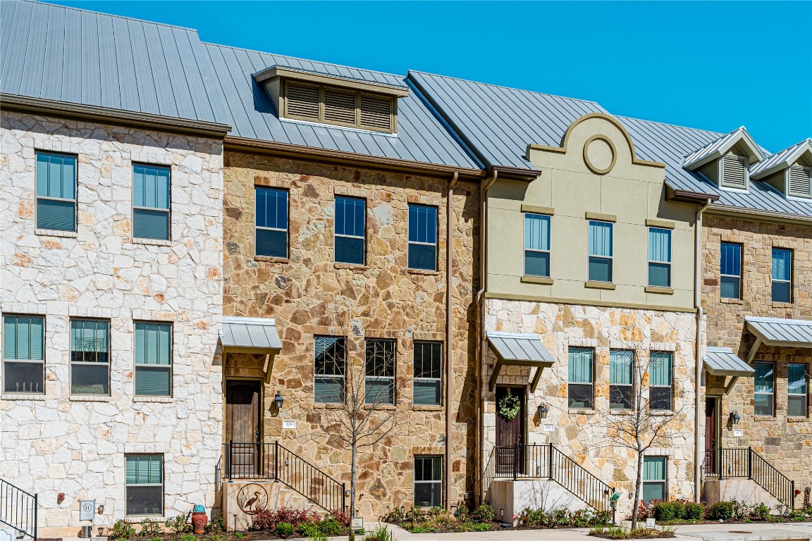 a front view of a house with a large windows