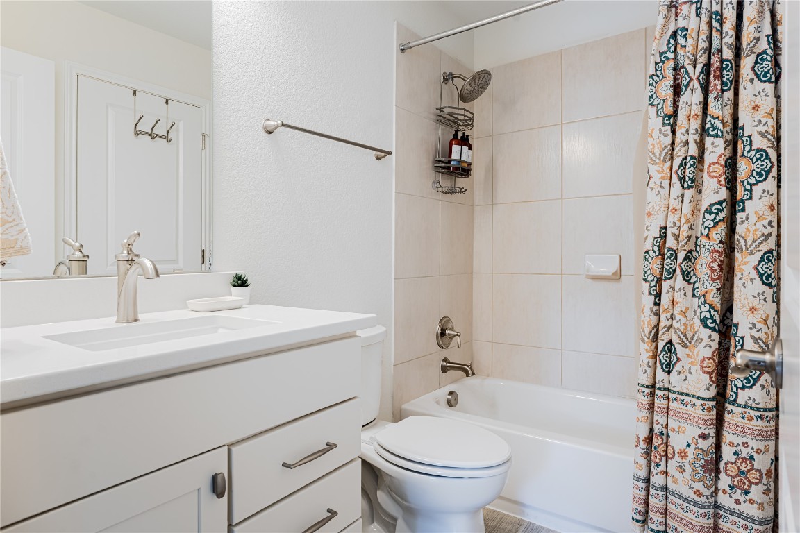 329 Adams Street Georgetown, TX 78628 - Photo 18 of 34 a bathroom with a sink toilet and shower