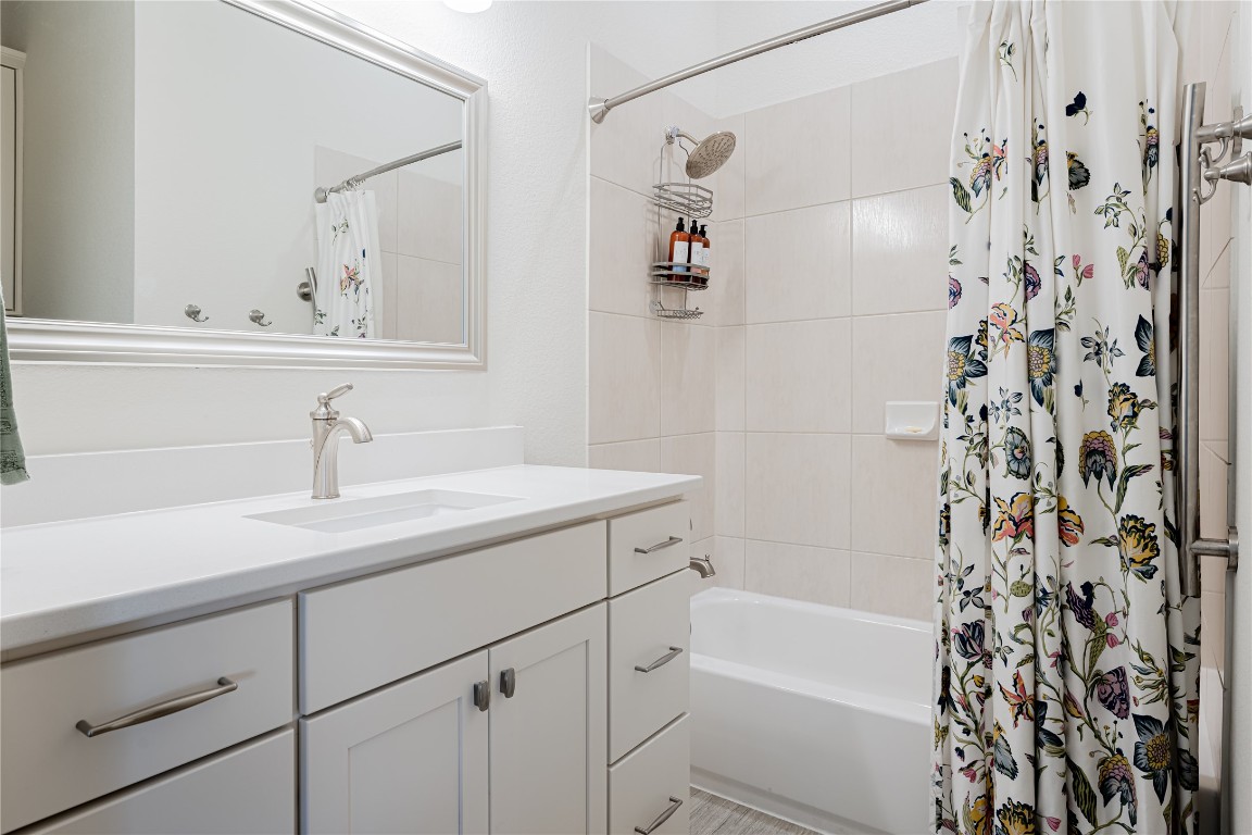 329 Adams Street Georgetown, TX 78628 - Photo 22 of 34 a bathroom with a sink and a mirror