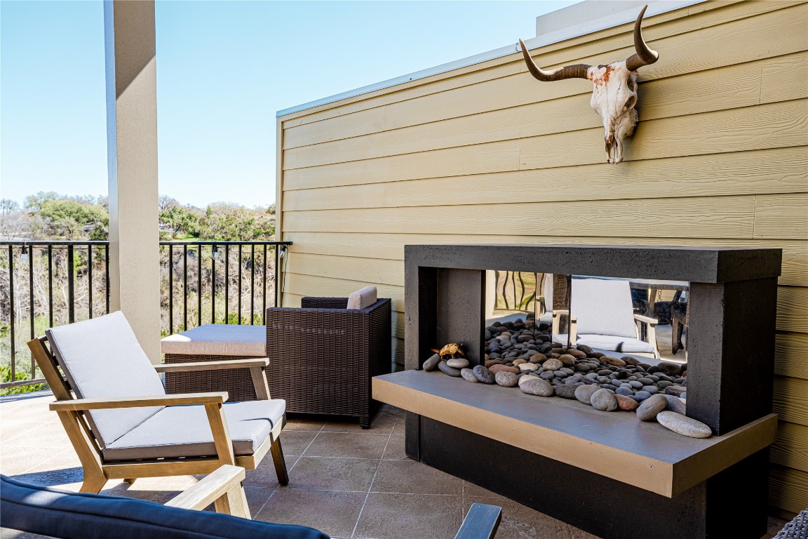 329 Adams Street Georgetown, TX 78628 - Photo 28 of 34 a view of a chairs and a table in a balcony