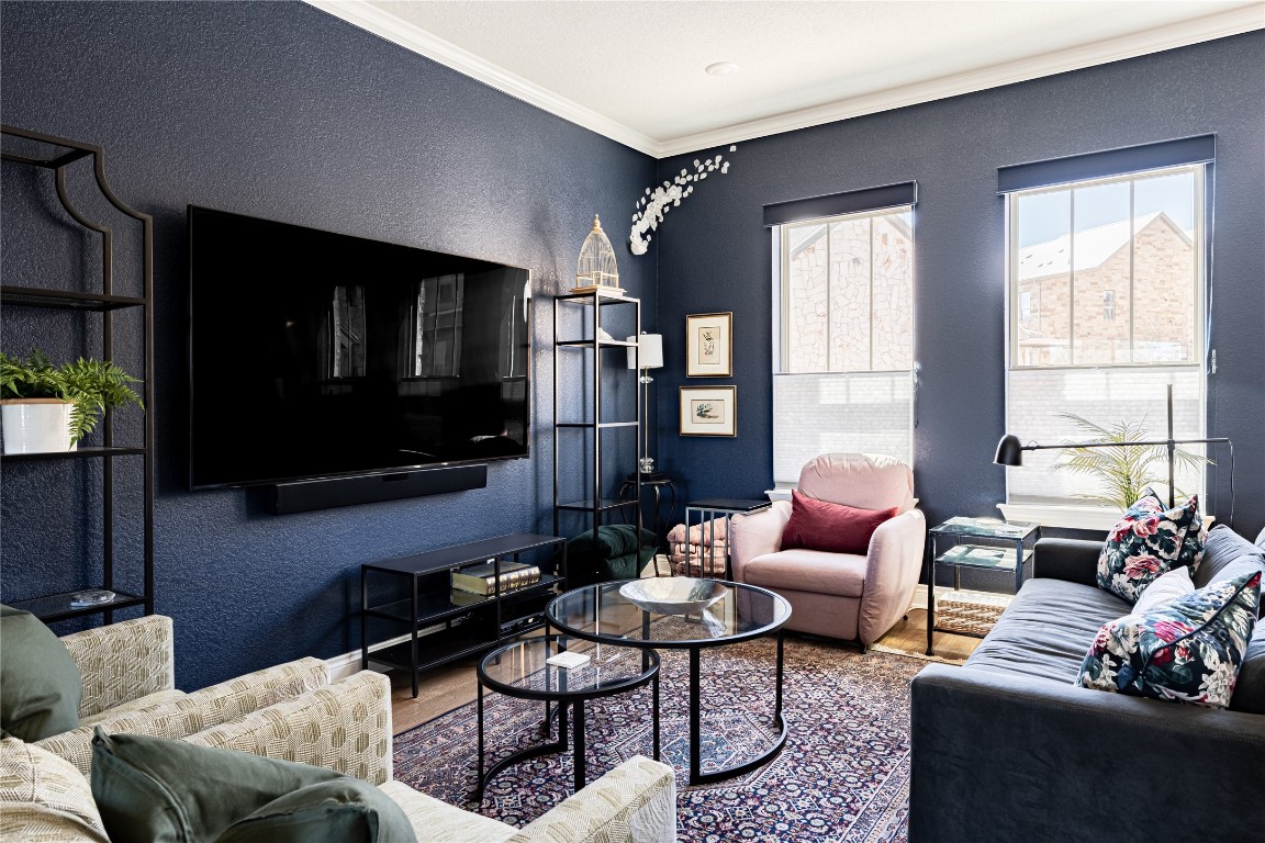 329 Adams Street Georgetown, TX 78628 - Photo 3 of 34 a living room with furniture fireplace and a flat screen tv