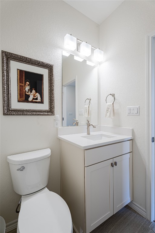 329 Adams Street Georgetown, TX 78628 - Photo 32 of 34 a bathroom with a toilet sink and mirror