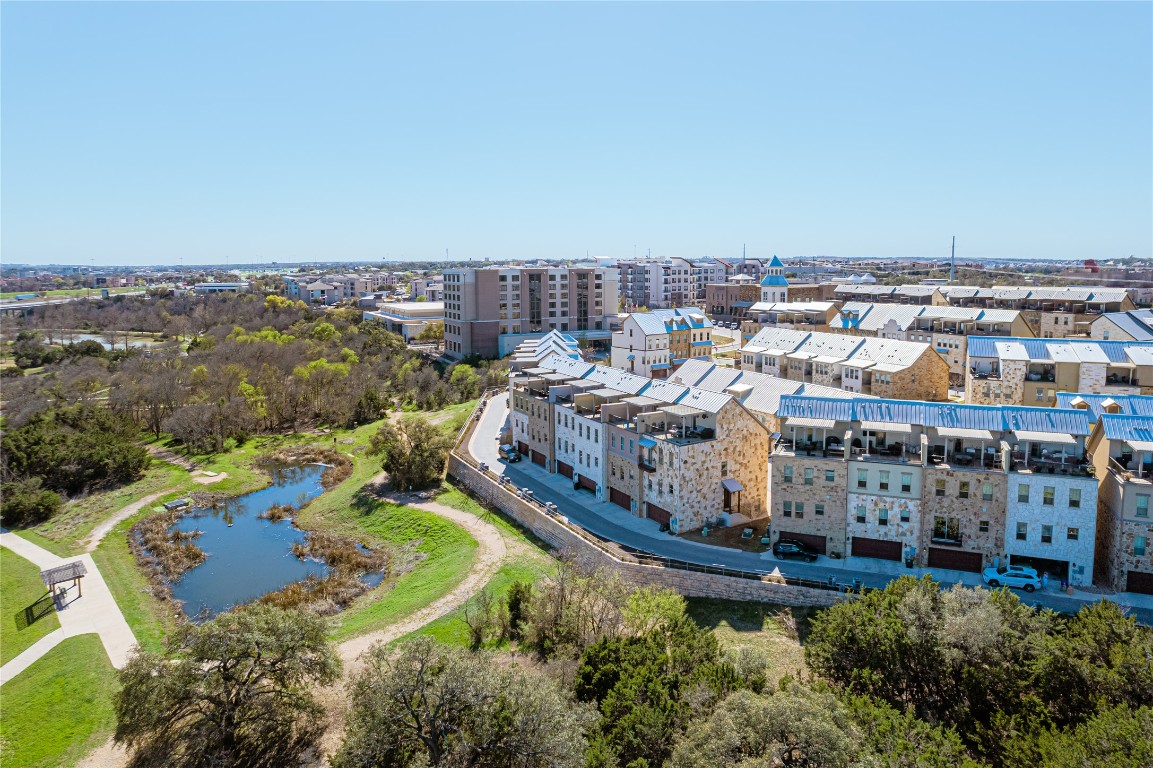 329 Adams Street Georgetown, TX 78628 - Photo 34 of 34 an aerial view of a house with a garden and lake view