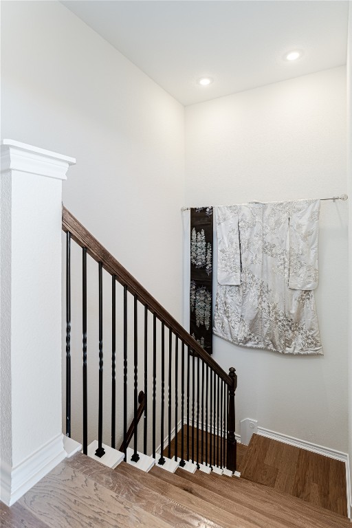 329 Adams Street Georgetown, TX 78628 - Photo 10 of 34 a view of a hallway with wooden floor and stairs