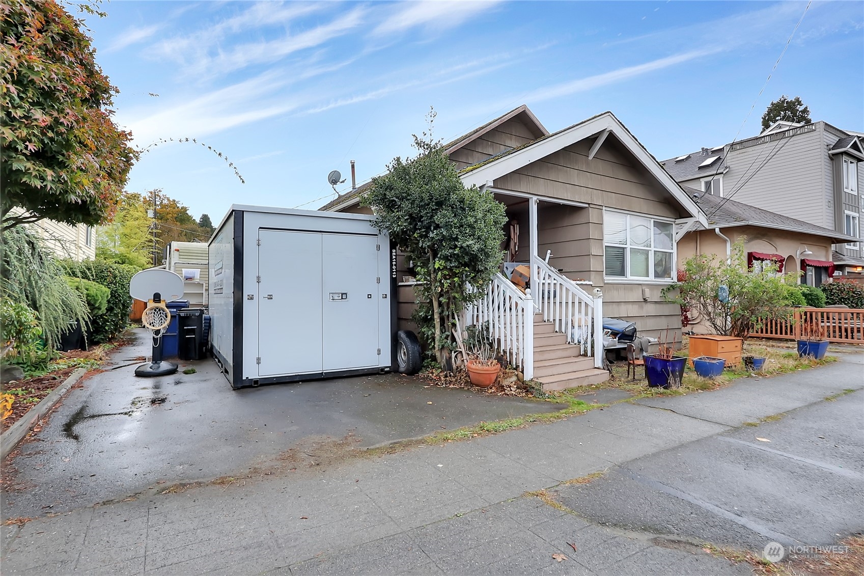2620 Marine Avenue Southwest Seattle, WA 98116 - Photo 16 of 21 a view of a house with a yard and plants