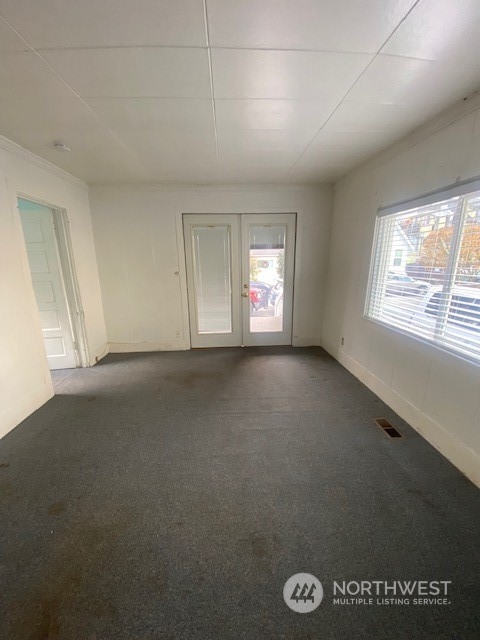 2620 Marine Avenue Southwest Seattle, WA 98116 - Photo 3 of 21 an empty room with windows