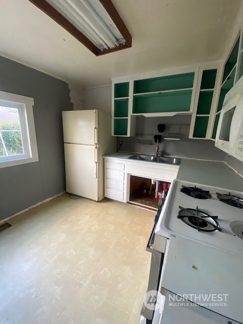 2620 Marine Avenue Southwest Seattle, WA 98116 - Photo 5 of 21 a kitchen with furniture and a fireplace