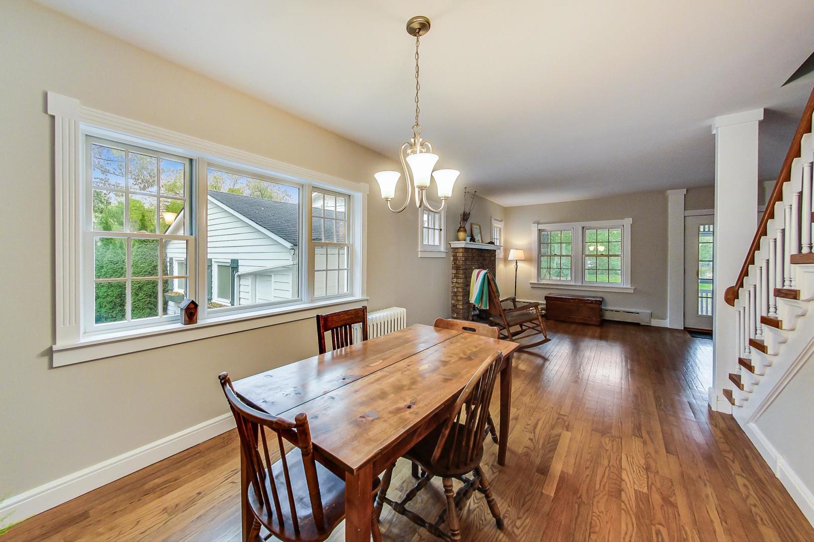 583 North Happ Road Northfield, IL 60093 - Photo 14 of 63 a view of a dining room with furniture window and wooden floor