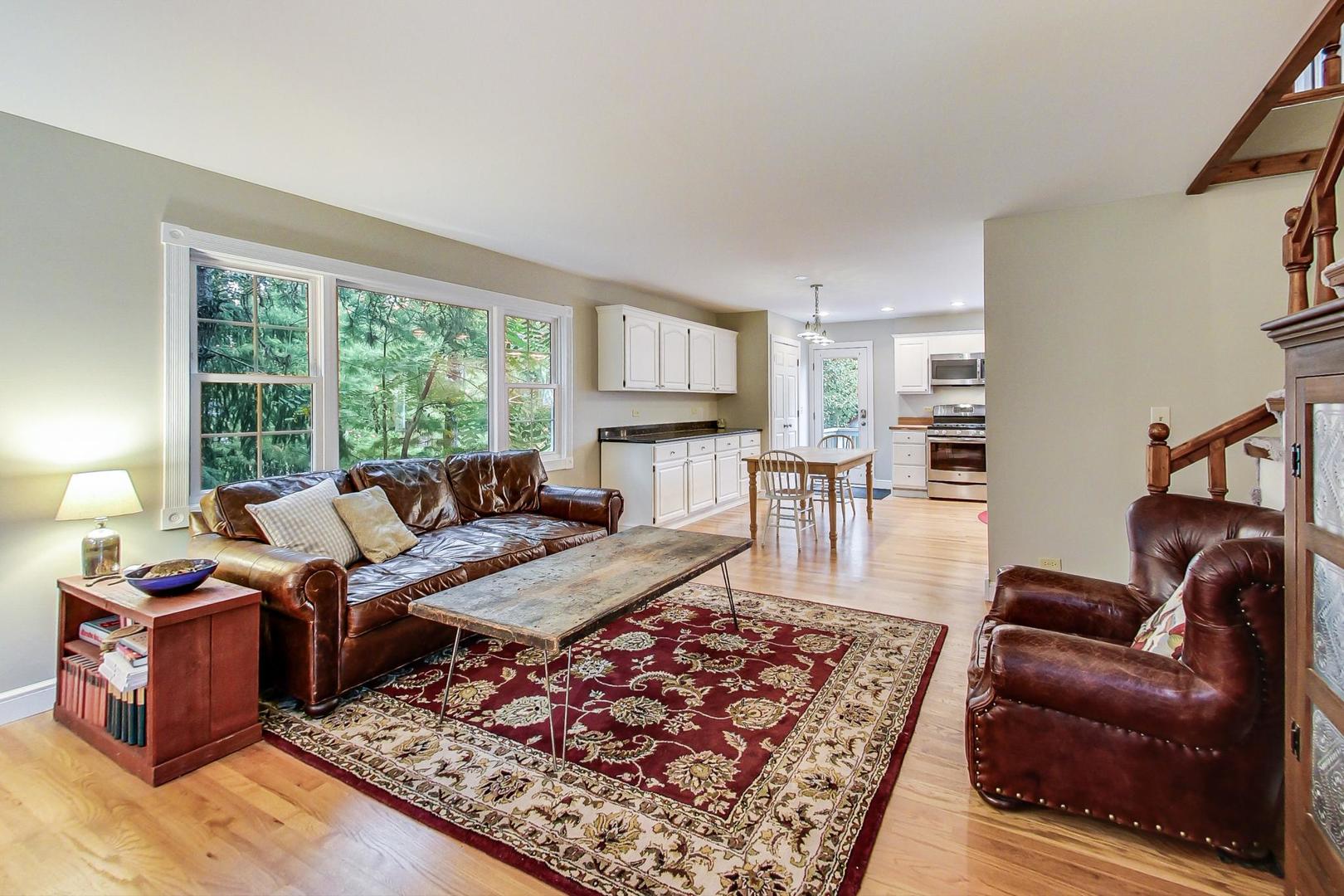 583 North Happ Road Northfield, IL 60093 - Photo 22 of 63 a living room with furniture and a rug