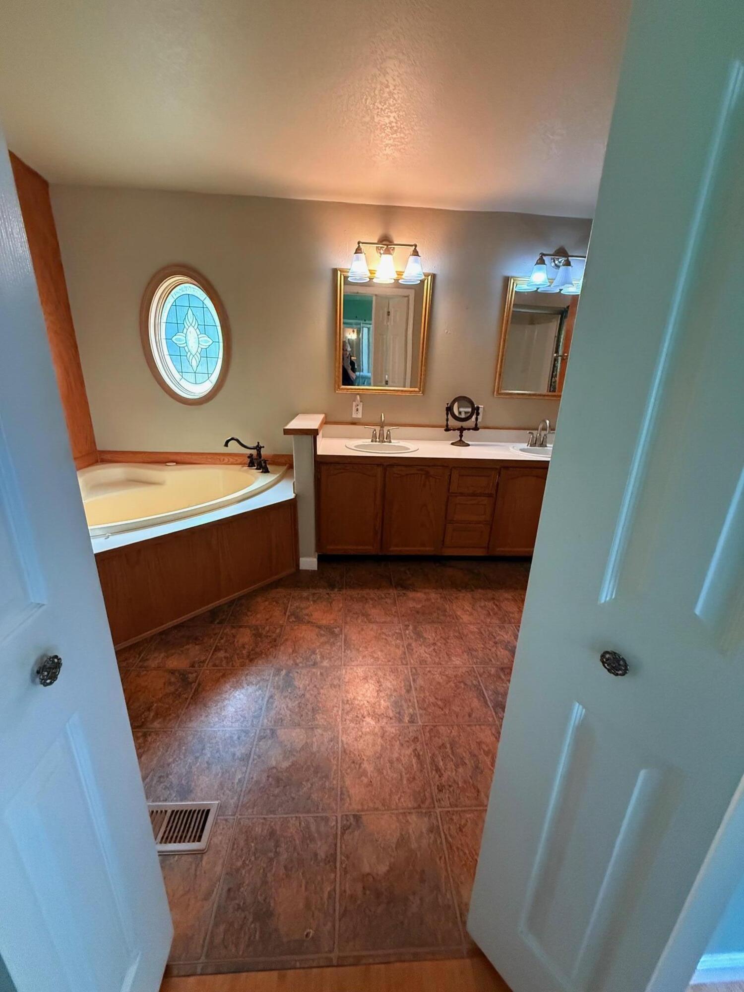 1800 Dick George Road Cave Junction, OR 97523 - Photo 15 of 37 master bath dbl vanity, vinyl flooring