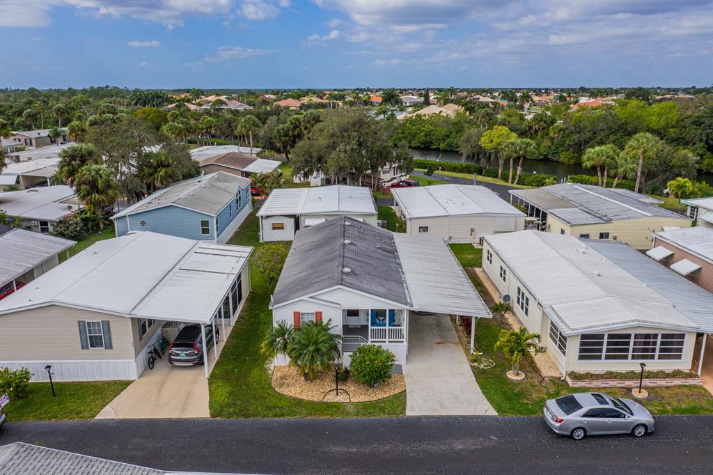 an aerial view of a houses with a garden