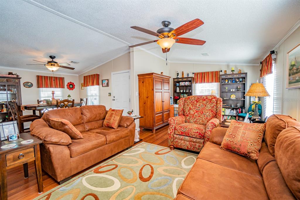10303 Burnt Store Road, Unit 203 Punta Gorda, FL 33950 - Photo 14 of 41 a living room with furniture and kitchen view