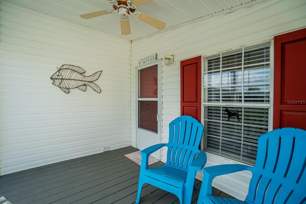 10303 Burnt Store Road, Unit 203 Punta Gorda, FL 33950 - Photo 2 of 41 a view of a room with furniture and wooden floor