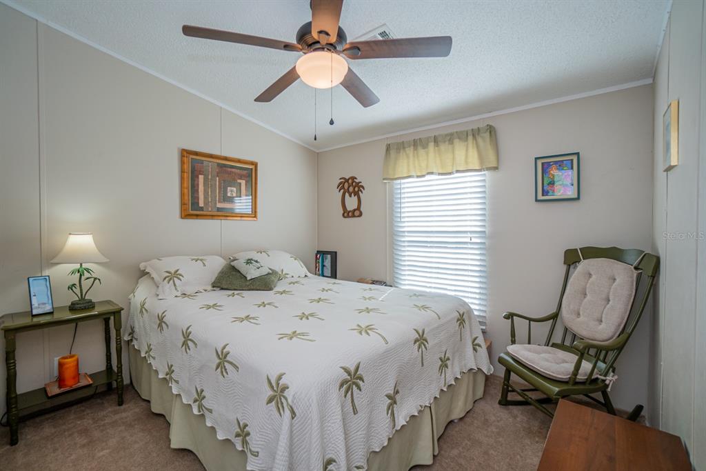 10303 Burnt Store Road, Unit 203 Punta Gorda, FL 33950 - Photo 25 of 41 a bedroom with bed and a window