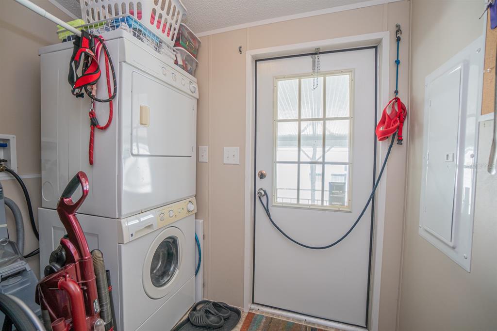 10303 Burnt Store Road, Unit 203 Punta Gorda, FL 33950 - Photo 27 of 41 a utility room with dryer and washer