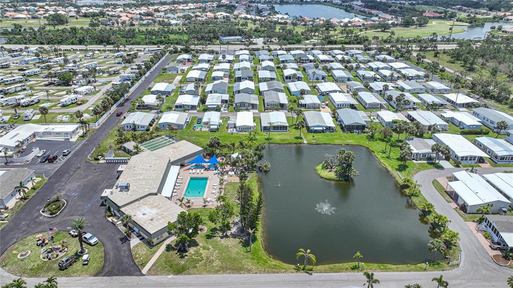 10303 Burnt Store Road, Unit 203 Punta Gorda, FL 33950 - Photo 38 of 41 an aerial view of residential houses with outdoor space