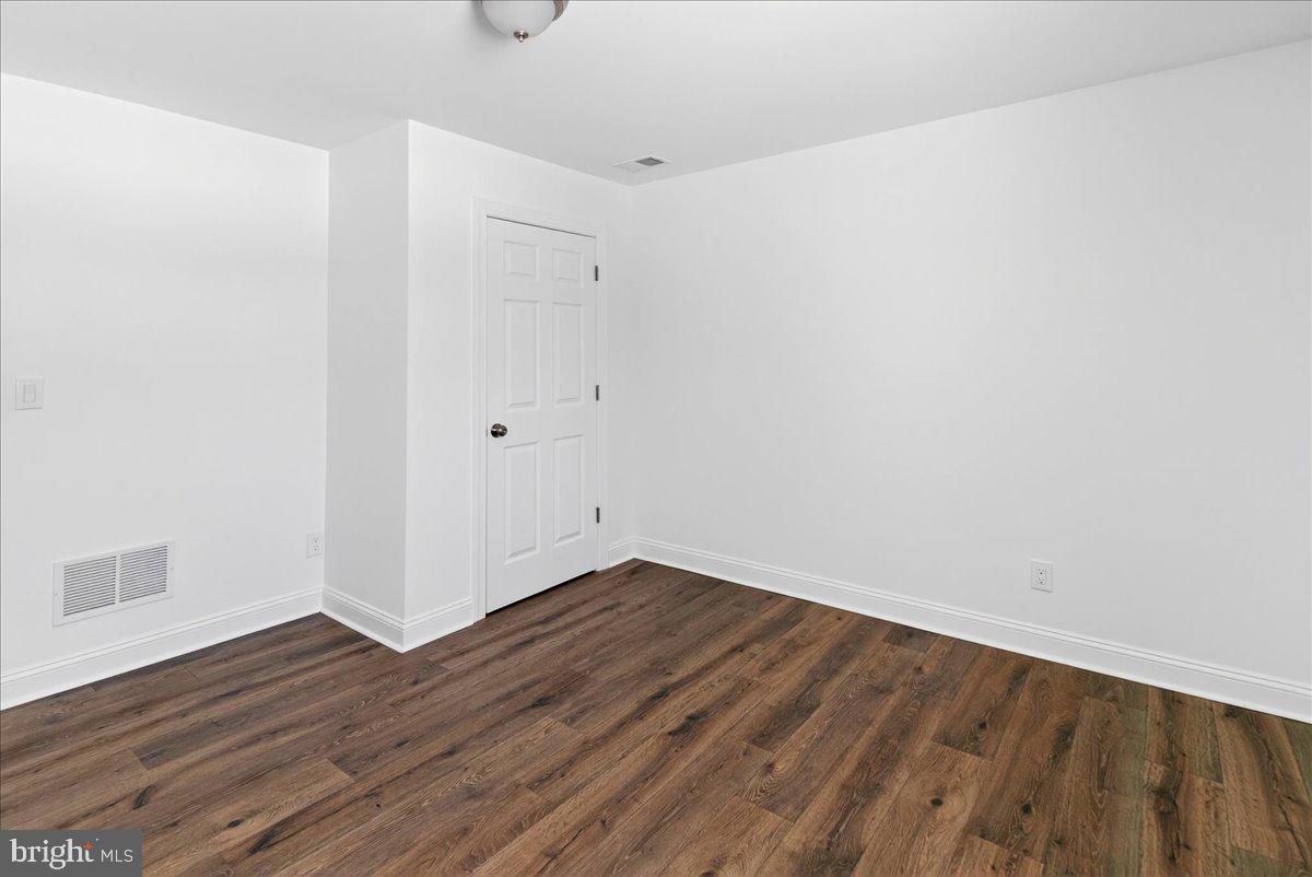 464 Sykesville Road Wrightstown, NJ 08562 - Photo 24 of 32 a view of an empty room with wooden floor