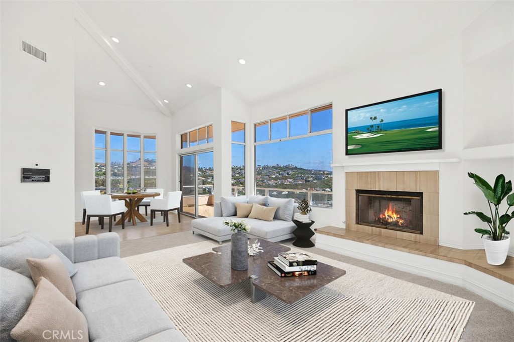 4 Tesoro San Clemente, CA 92673 - Photo 13 of 60 a living room with furniture a fireplace and a flat screen tv