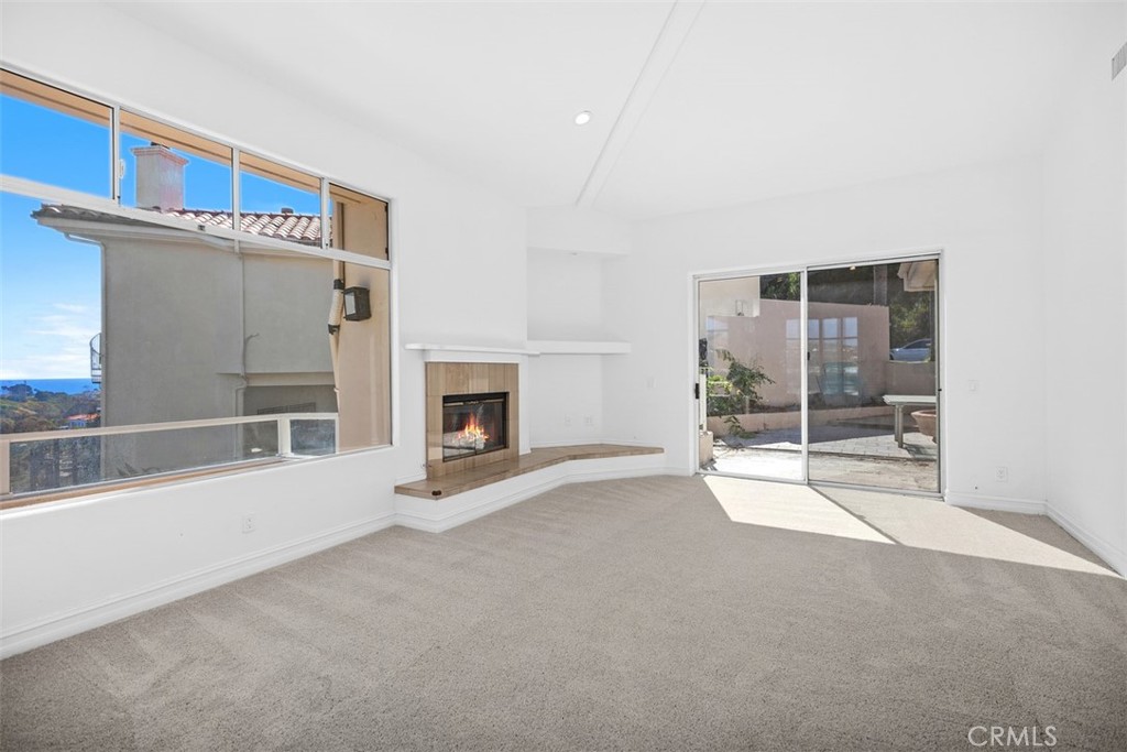 4 Tesoro San Clemente, CA 92673 - Photo 17 of 60 a view of a livingroom with an empty space and a fireplace