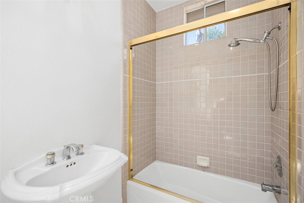4 Tesoro San Clemente, CA 92673 - Photo 19 of 60 a bathroom with a sink a toilet and shower